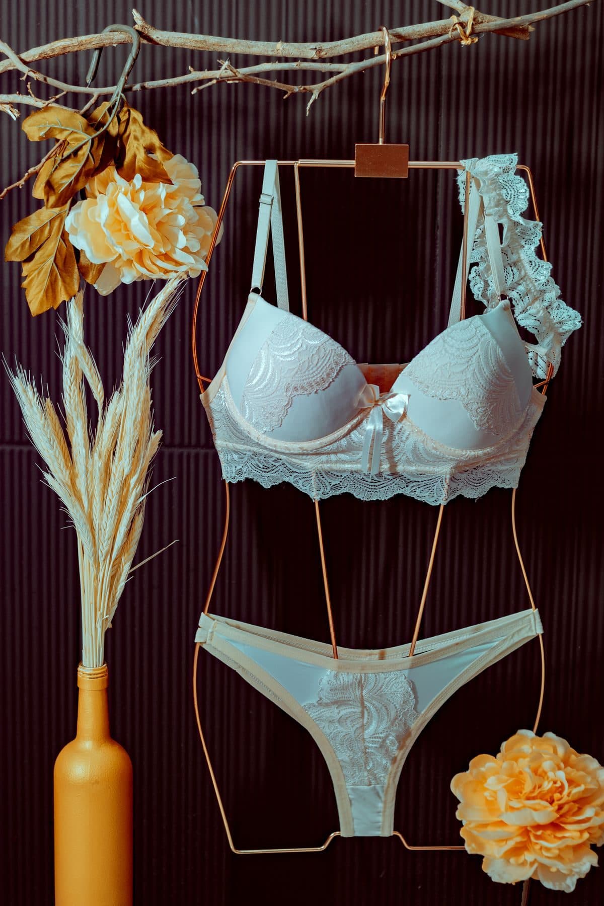 Mint lace bra and panty set displayed on a hanger